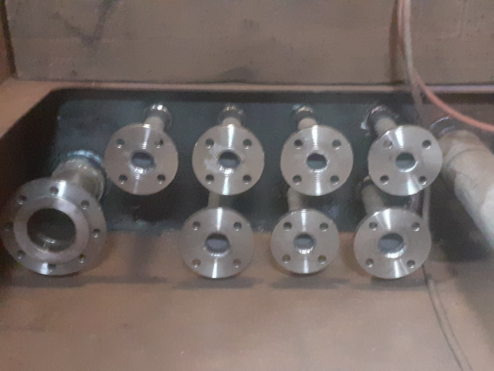 Fabricated stainless-steel pipe spools with welded flanges prepared for marine installation